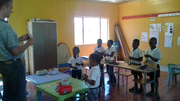 Children playing music with recorders